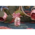 Papillon rose sur pot en verre
