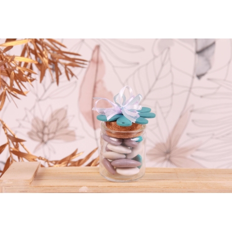 Fleur en bois bleue sur pot en verre