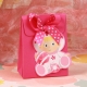Pochette Bébé hochet rose - Boîtes à dragées - Dragées Braquier